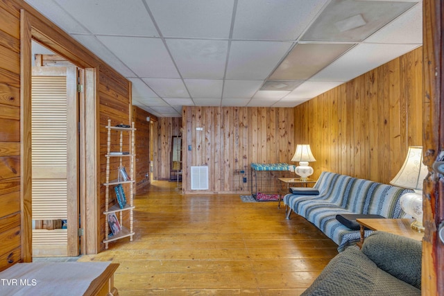 2390 W Allens Bridge Rd, Greeneville, TN 37743 - living area with wood walls, a paneled ceiling, and hardwood / wood-style floors