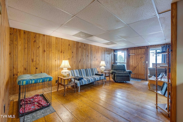 2390 W Allens Bridge Rd, Greeneville, TN 37743 - living area featuring a paneled ceiling, hardwood / wood-style floors, and wooden walls