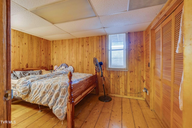 2390 W Allens Bridge Rd, Greeneville, TN 37743 - bedroom featuring light wood finished floors, wood walls, and a paneled ceiling