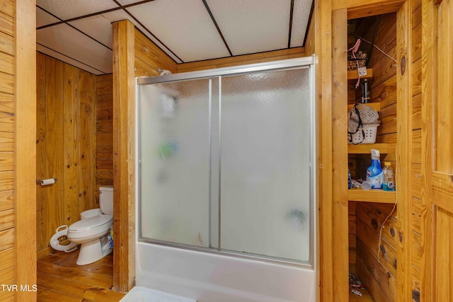 2390 W Allens Bridge Rd, Greeneville, TN 37743 - full bathroom with toilet, combined bath / shower with glass door, wood finished floors, and wooden walls