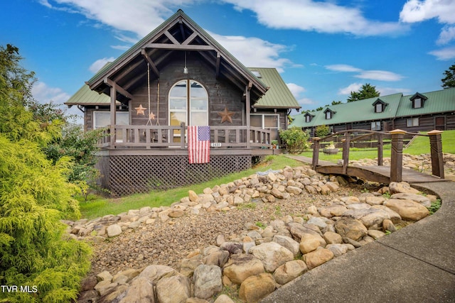 2390 W Allens Bridge Rd, Greeneville, TN 37743 - chalet / cabin featuring metal roof, a sunroom, and stone siding