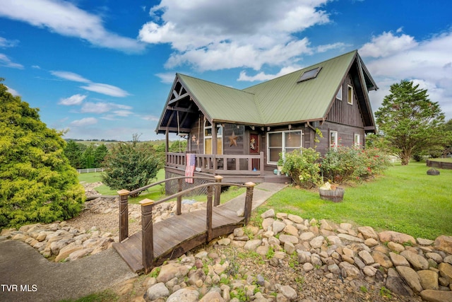 2390 W Allens Bridge Rd, Greeneville, TN 37743 - view of front of home with metal roof, a front lawn, and a sunroom