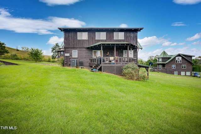 2390 W Allens Bridge Rd, Greeneville, TN 37743 - back of property with a lawn and a wooden deck