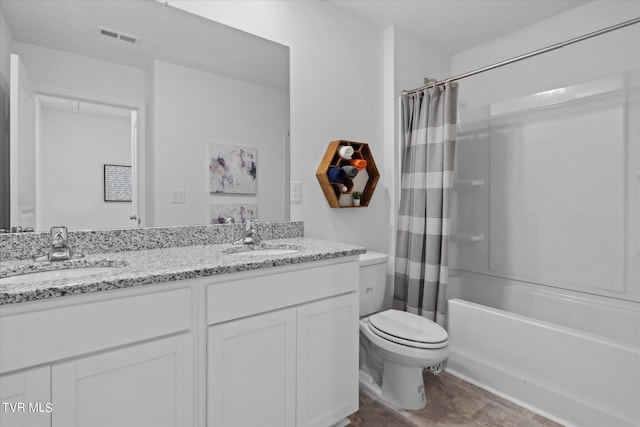 full bathroom featuring shower / bath combo with shower curtain, vanity, and toilet