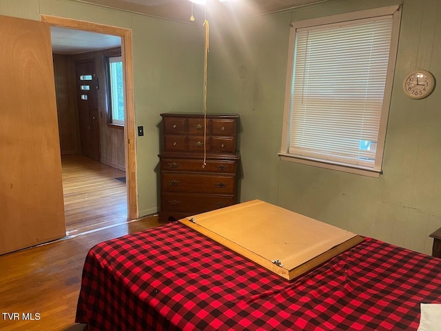 bedroom with wood finished floors