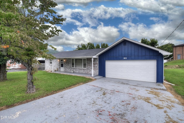 single story home featuring stone siding, board and batten siding, concrete driveway, an attached garage, and a front yard