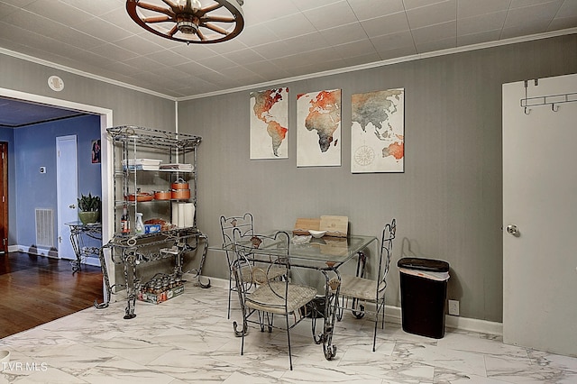 dining room featuring visible vents, marble finish floor, and ornamental molding