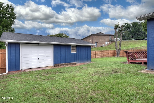 view of yard featuring an outbuilding and fence