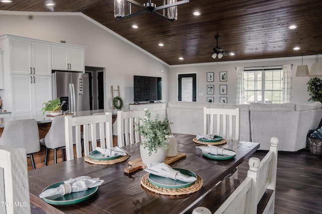 dining space with dark wood-type flooring, lofted ceiling, crown molding, wooden ceiling, and ceiling fan