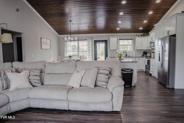 living room featuring lofted ceiling, crown molding, an inviting chandelier, dark hardwood / wood-style floors, and wooden ceiling