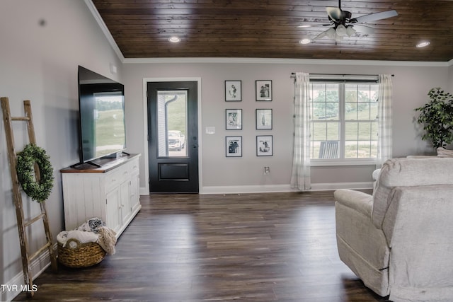 entrance foyer featuring wood ceiling, dark wood-type flooring, ornamental molding, and ceiling fan