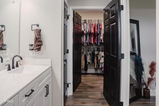 bathroom with vanity and hardwood / wood-style floors