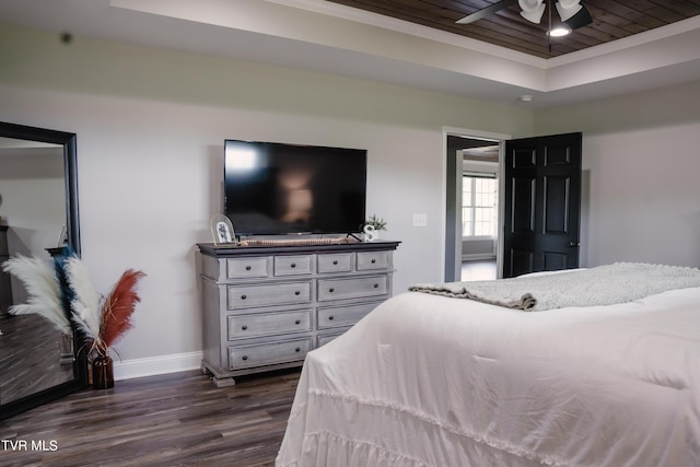 bedroom featuring a raised ceiling, ornamental molding, wood ceiling, and dark hardwood / wood-style flooring