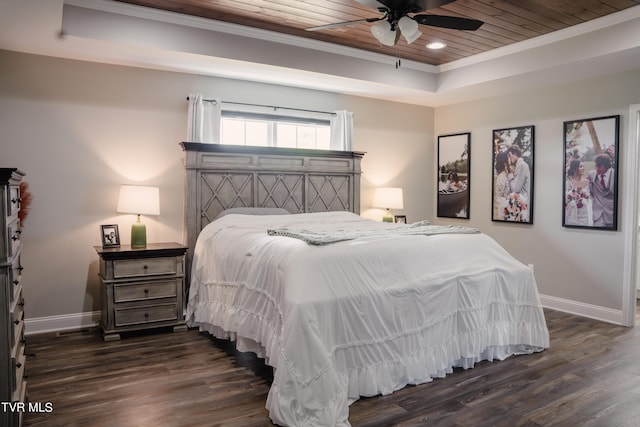 bedroom featuring ornamental molding, a raised ceiling, dark wood-type flooring, wood ceiling, and ceiling fan