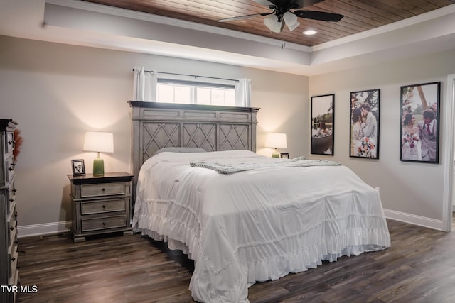 bedroom featuring ornamental molding, dark hardwood / wood-style flooring, a raised ceiling, and wooden ceiling