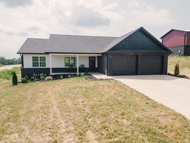 single story home featuring a garage and a front yard