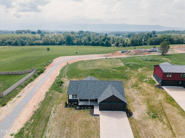 drone / aerial view featuring a mountain view and a rural view