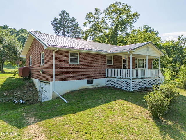 view of front of home with a front lawn and a porch