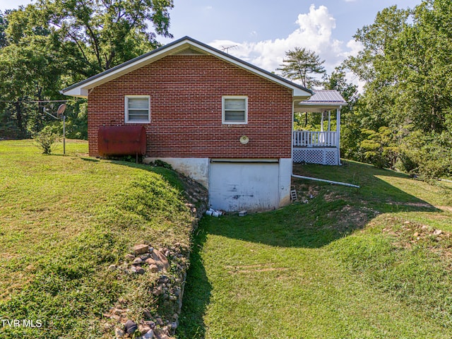 view of property exterior featuring a lawn