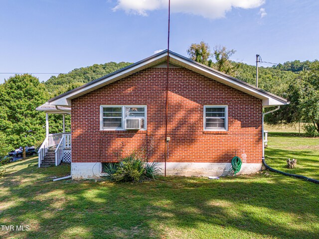 view of home's exterior featuring a lawn