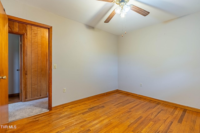 empty room featuring ceiling fan and light wood-type flooring