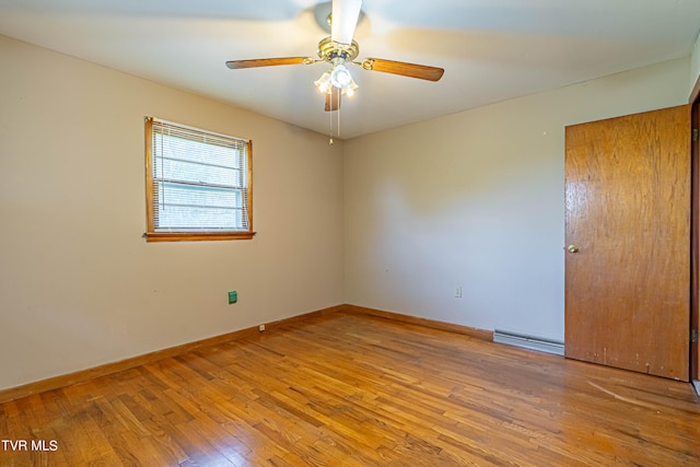 unfurnished room featuring ceiling fan, a baseboard radiator, and light hardwood / wood-style flooring