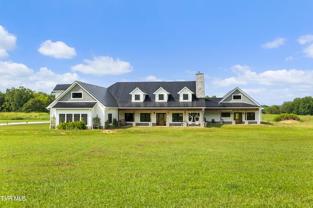 view of front of house featuring a front lawn and covered porch