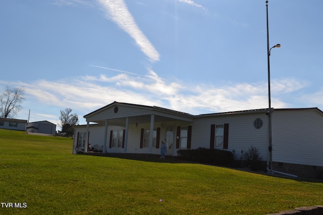 view of front of house with a porch and a front lawn