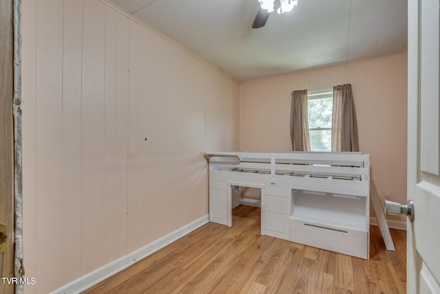 bedroom featuring light wood-type flooring and ceiling fan