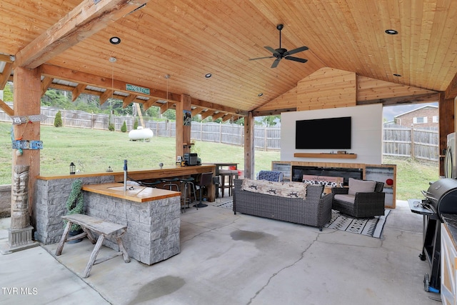 view of patio / terrace featuring ceiling fan, outdoor dry bar, a fenced backyard, and an outdoor living space