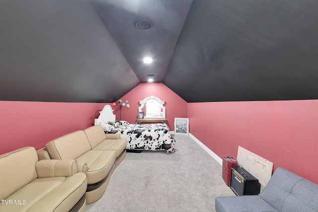 carpeted cinema featuring lofted ceiling, visible vents, and baseboards