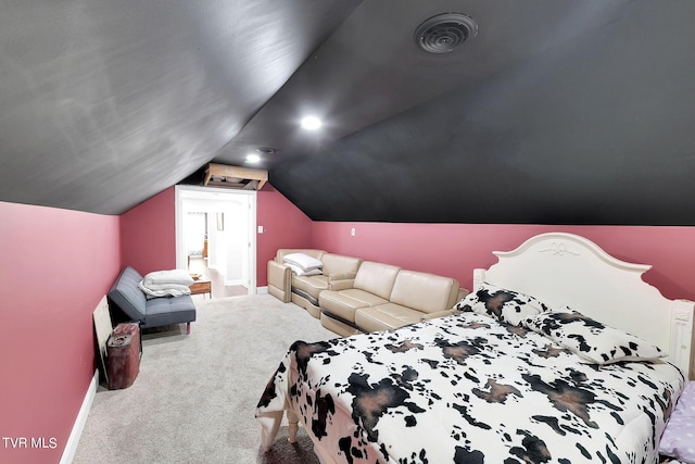 carpeted bedroom featuring baseboards, visible vents, and vaulted ceiling