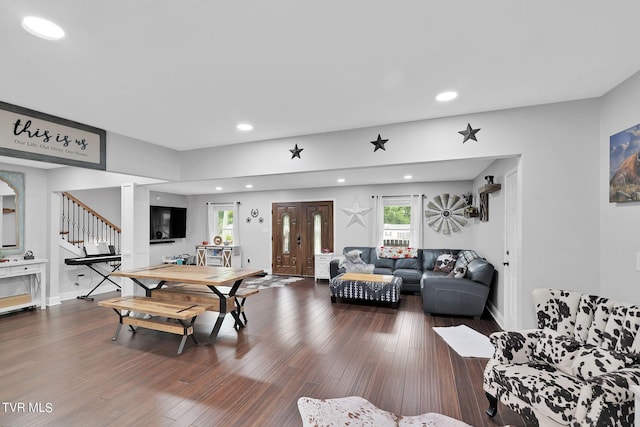 living area with stairs, baseboards, wood finished floors, and recessed lighting