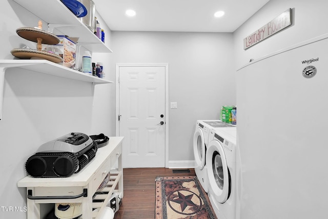 laundry area featuring recessed lighting, laundry area, dark wood-style flooring, baseboards, and washer and dryer