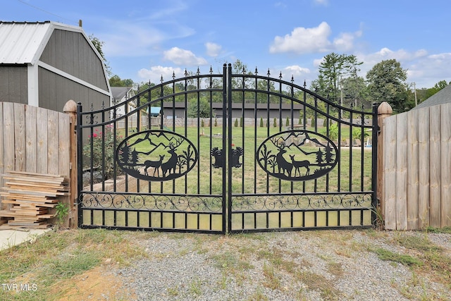 view of gate featuring a lawn