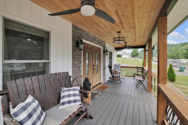 wooden deck with ceiling fan