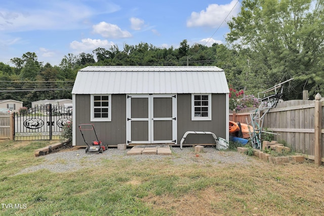 view of shed featuring fence