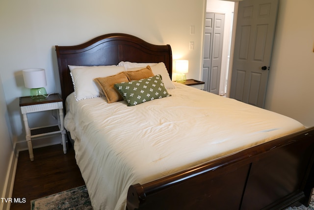 bedroom featuring dark hardwood / wood-style floors