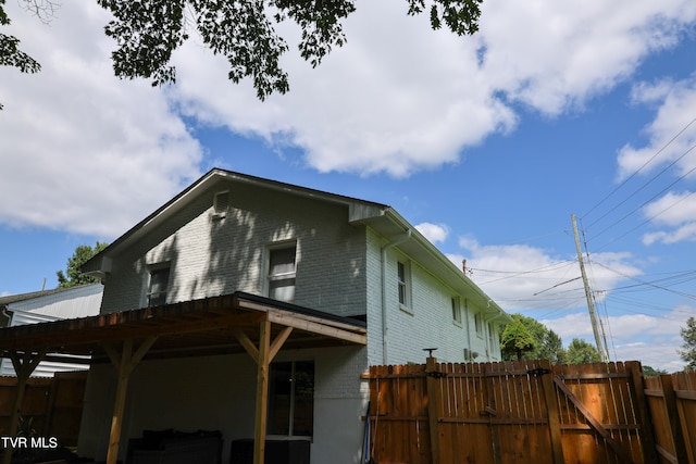 back of house with a pergola