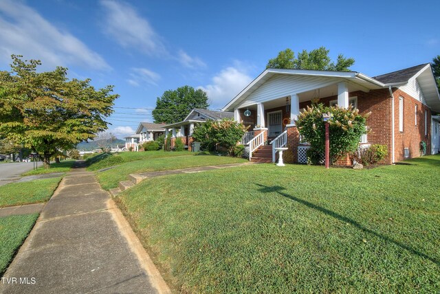 view of side of home with a porch