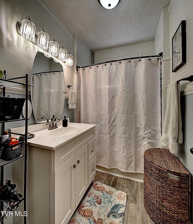 bathroom with vanity and a textured ceiling