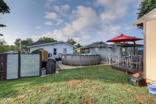 view of yard featuring a pool side deck