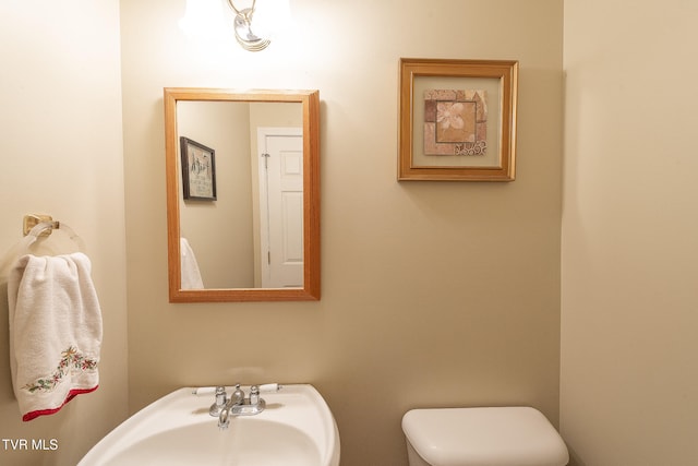 bathroom featuring sink and toilet