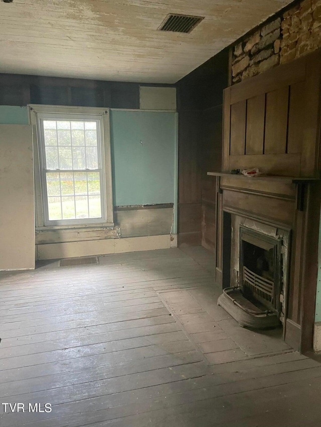 unfurnished living room featuring hardwood / wood-style flooring