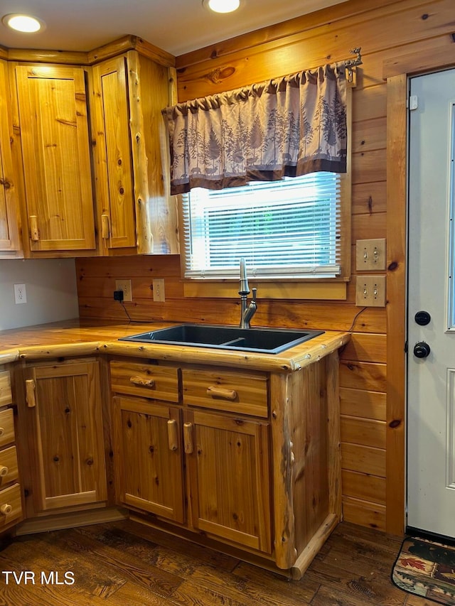 kitchen featuring sink and dark hardwood / wood-style flooring