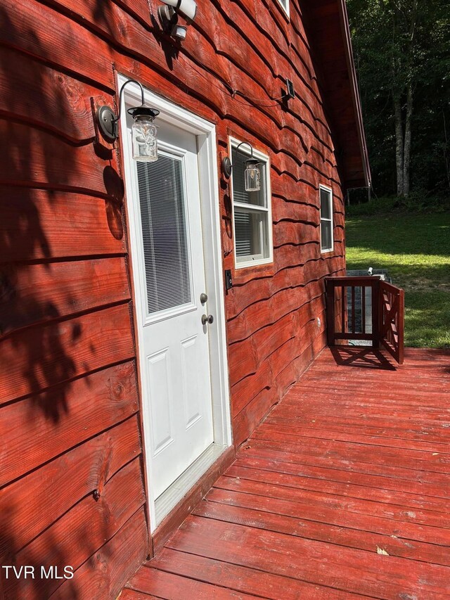 entrance to property with a wooden deck