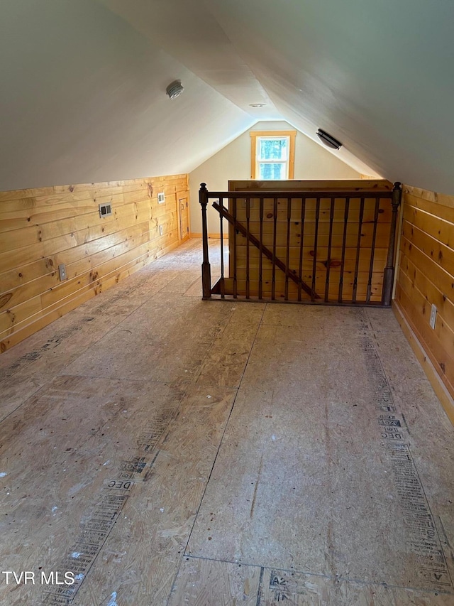 additional living space featuring vaulted ceiling