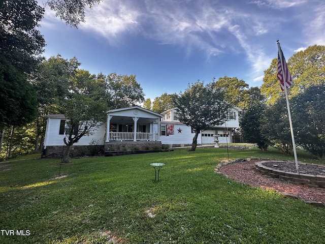 view of yard with covered porch