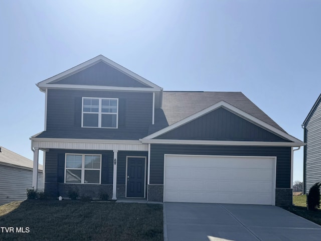 craftsman house featuring a porch, a garage, and driveway