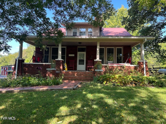 view of front facade with a porch and a front lawn